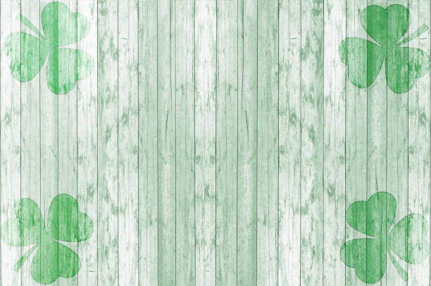 St Patricks day background. Shamrocks over a light green wood background. Decoration for St. Patrick's Day.