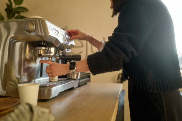 istock Barista preparing cappuccino with professional coffee machine in modern cafe 2198648193