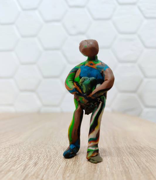 An intricately designed clay figurine that vividly showcases vibrant colors combined with an artistic flair