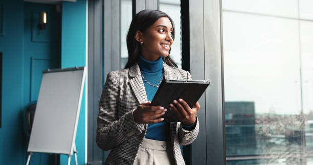 istock Thinking, tablet and smile with business woman in office for workshop coordinator, reflection and corporate trainer. Vision, planning and conference organizer with person in agency for schedule 2198649624