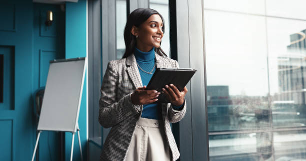 istock Thinking, tablet and happy with business woman in office for workshop coordinator, reflection and corporate trainer. Vision, planning and conference organizer with person in agency for schedule 2198649625
