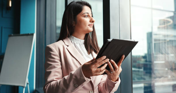 istock Thinking, tablet and future with business woman in office for workshop coordinator, reflection and corporate trainer. Vision, planning and conference organizer with person in agency for schedule 2198649691