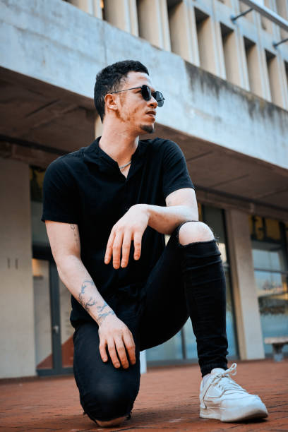 istock Stylish Man in Urban Setting Exhibiting Confidence 2198650200