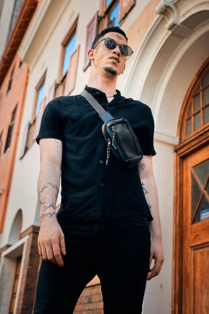istock Fashionable Man with Accessories Posing in Urban Setting Featuring Vitiligo 2198650247