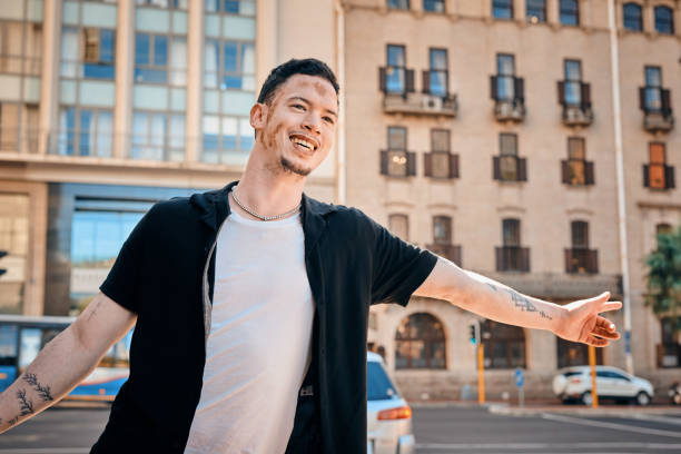 istock Stylish Man with Vitiligo Smiling in Urban Setting Amidst Modern Architecture 2198650264