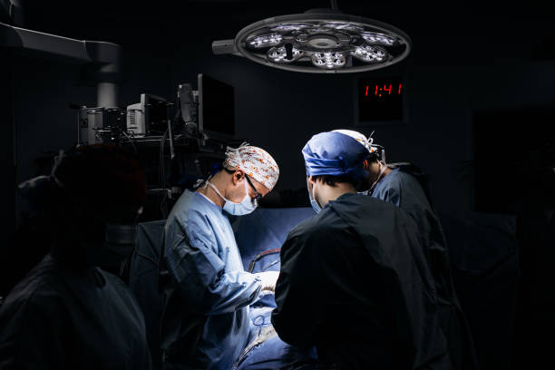 istock A team of professional surgeons performs surgery in a modern hospital. 2198650336