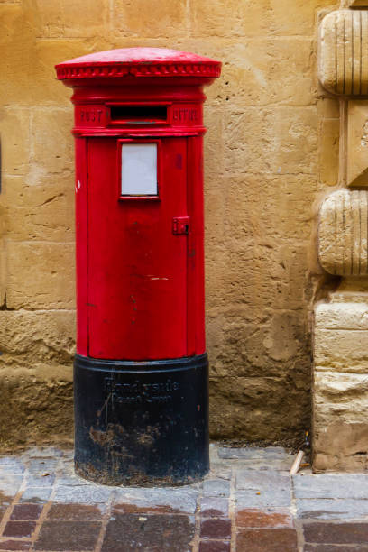 istock Vintage Red Mailbox Against a Rustic Stone Wall in Urban Setting 2198652006