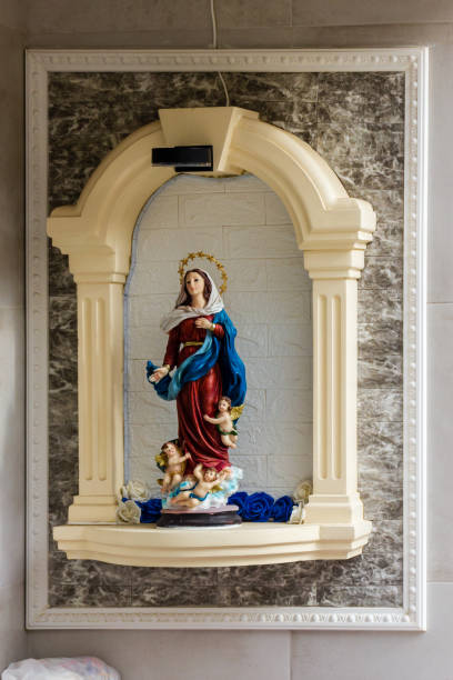istock Statue of Virgin Mary with Angels in Decorative Niche 2198652021