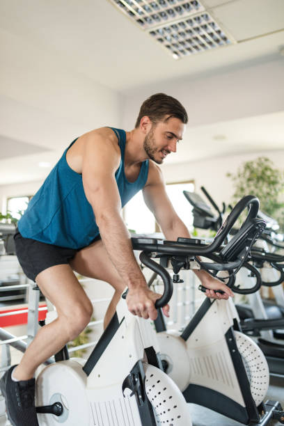 istock man on the cyclette at the gym 2198652945