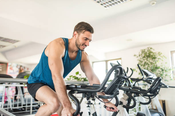 istock man on the cyclette at the gym 2198653032