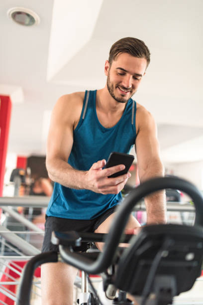 istock man on the cyclette at the gym 2198653111