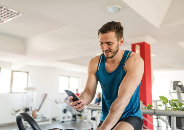 istock man on the cyclette at the gym 2198653181