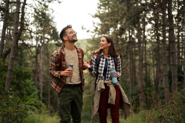 istock Beautiful young couple exploring nature 2198660678