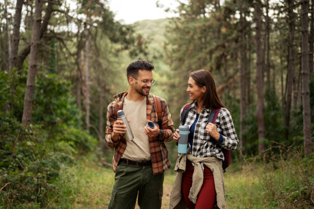 istock Beautiful young couple exploring nature 2198660734