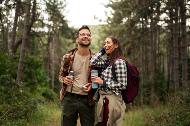 istock Beautiful young couple exploring nature 2198660776