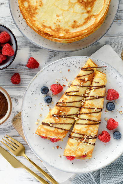 istock Thin pancakes or crepes with cottage cheese filling 2198664395