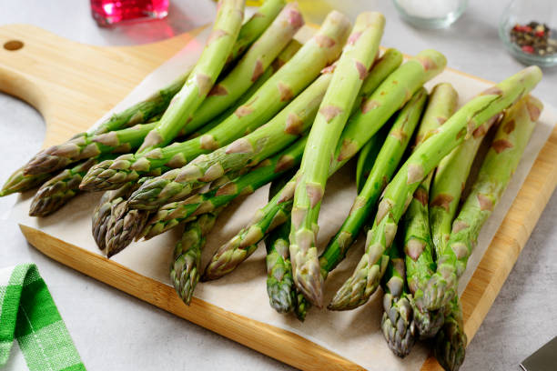 Fresh Green Asparagus on cutting board