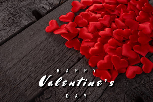 istock Red Hearts on Wooden Background with Happy Valentine's Day Message 2198666421