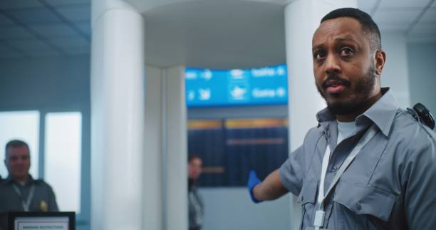 istock Security Officer Instructs Diverse People About TSA Screening Procedures for Boarding Flight 2198671408
