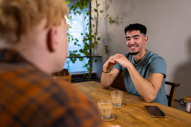 istock Candid Laughter and Conversation at a Coffee Shop 2198671634