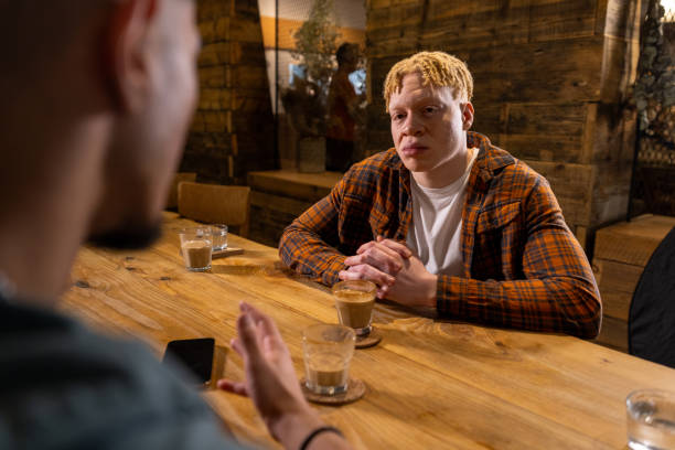 istock Serious Conversation at a Coffee Shop with a Friend 2198671745