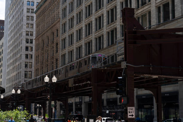 Chicago transit authority 'l' train passing over wabash avenue in the heart of chicago's loop, providing a glimpse into the city's bustling urban landscape
