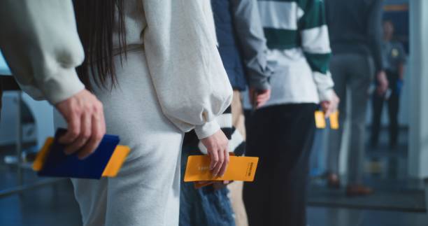 istock Airport Terminal: Queue of Diverse Tourists Standing with Tickets and Documents in Hands 2198674119