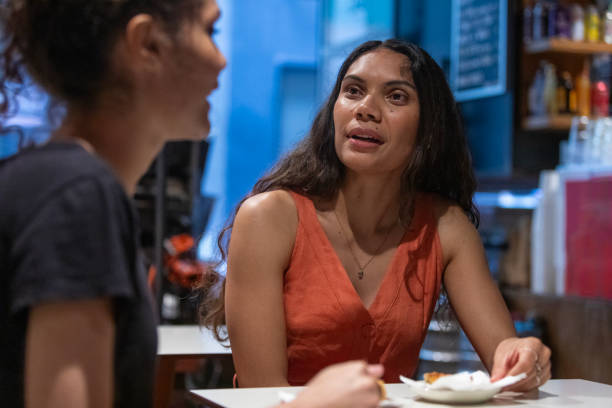 istock Happy Australian Aboriginal Friends Talking in a Cafe Together 2198674266