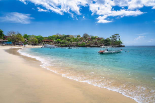 istock A tranquil beachscape featuring stunning turquoise waters alongside gentle and calming waves lapping at the shore 2198677003