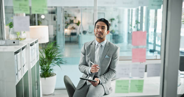 istock Thinking, sticky notes and business man on tablet in office for schedule, brainstorming and problem solving on glass. Professional, corporate and man on digital tech for website, research or planning 2198677186