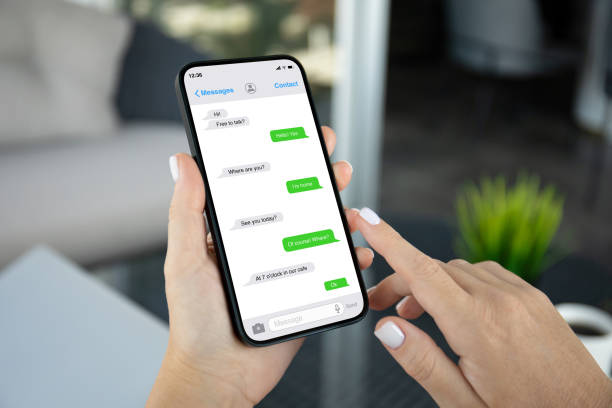 istock woman hands hold phone with app messenger on the screen 2198684268