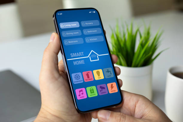 istock male hand hold phone with smart home application on screen 2198684489