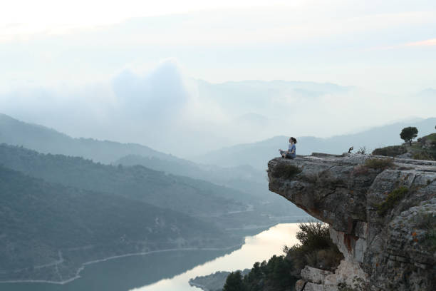 istock Yogi doing yoga in a cliff in nature 2198684524