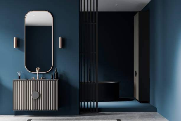 istock Modern bathroom with round mirrors and white sinks on wooden vanity against blue tiled wall. 3D Rendering 2198684556