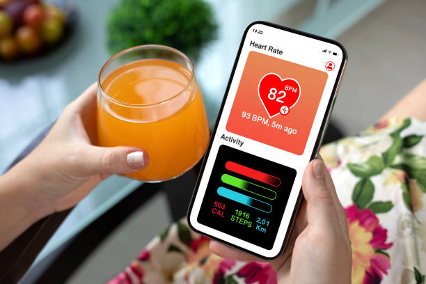 istock woman hand hold phone with app heart and activity screen 2198684683
