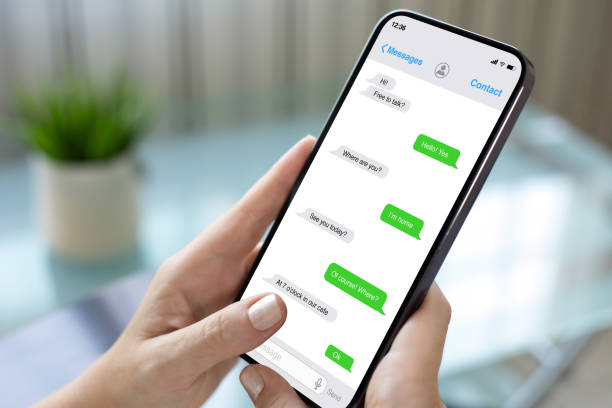 istock woman hands hold phone with app messenger on the screen 2198684732