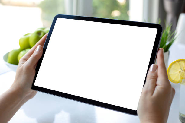 istock female hands holding computer tablet with isolated screen in cafe 2198684904