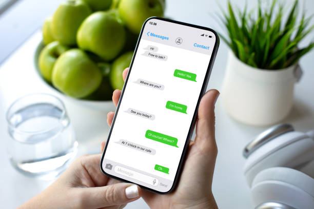 istock woman hands hold phone with app messenger on screen cafe 2198684927
