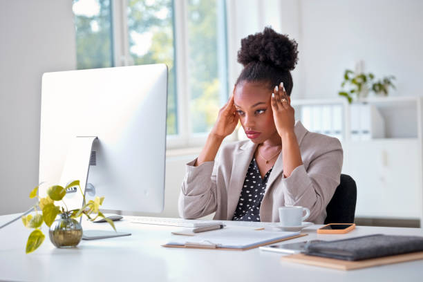 istock Overworked young woman in the office 2198685061