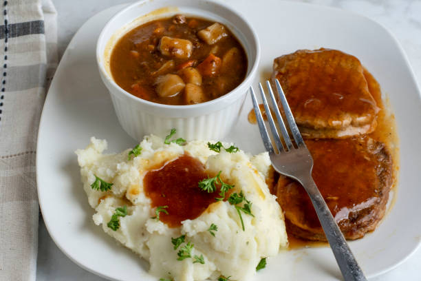 istock salisbury steak with beef stew  and mashed potatoes 2198685184