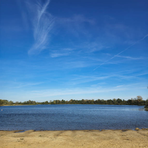 istock A Tranquil Lake Nestled Under a Bright Blue Sky, Perfect for Relaxation and Adventure Hufeisensee Wietzepark 2198686143