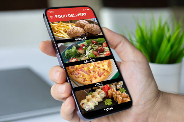 istock man hand hold phone with food delivery application on screen 2198686200