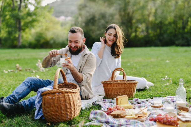 istock Smiling Boyfriend Indulging in Yogurt and Crackers Looking Like Enjoying 2198686268