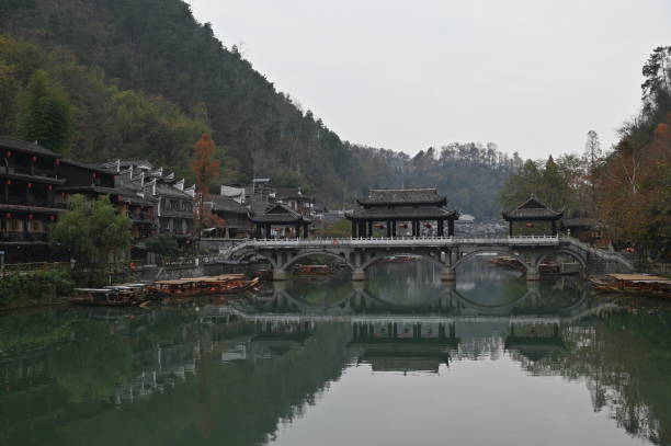 Fenghuang, China - December 23, 2024: Aerial View of the Phoenix Ancient Town in Fenghuang, Hunan China. Showing the century old traditional buildings of China during winter