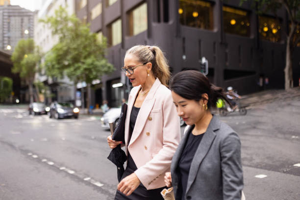 istock Business Professionals Walking in Sydney's Financial District Downtown 2198689101