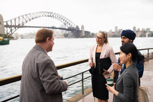 istock Multiracial Business Professionals Networking in Sydney by the Harbour Bridge 2198689253