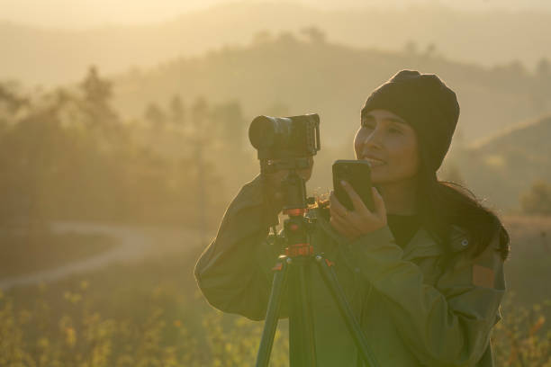 istock female landscape photographer camera 2198689681