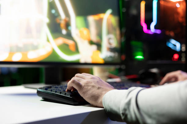 istock Close up on man at home doing live broadcast, playing videogames 2198690825