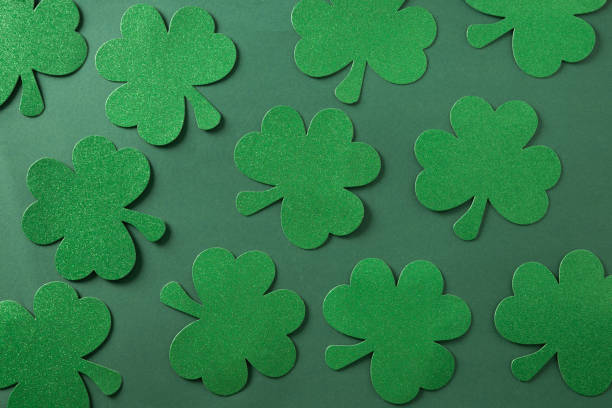 istock St. Patrick's day frame with clover leaves on green . 2198691000