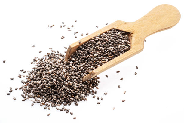 istock Chia seeds in wooden spoon isolated on white background. 2198694596